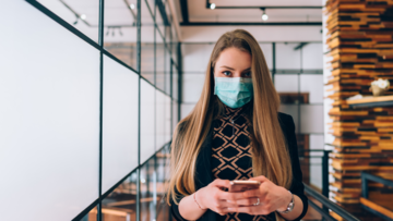 woman-with-mask-on-in-an-office