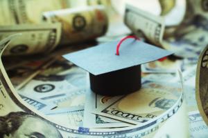 Graduation cap with dollar bills